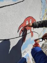 Wspólne malowanie połączyło dzieci, rodziców i artystów